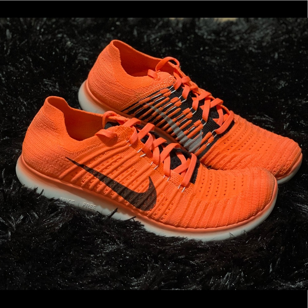 Women’s Coral Nike Flyknit running shoes size 8
